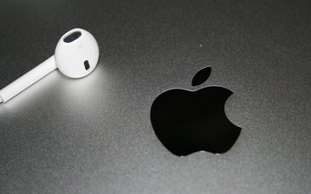Headphones near an Apple Logo