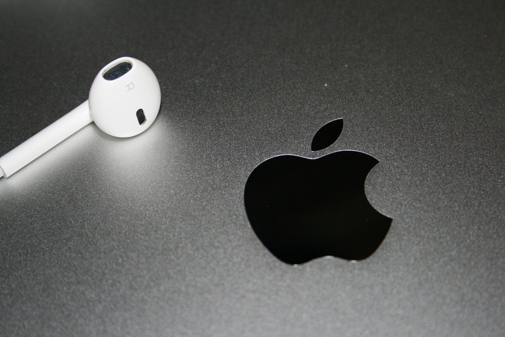 Headphones near an Apple Logo